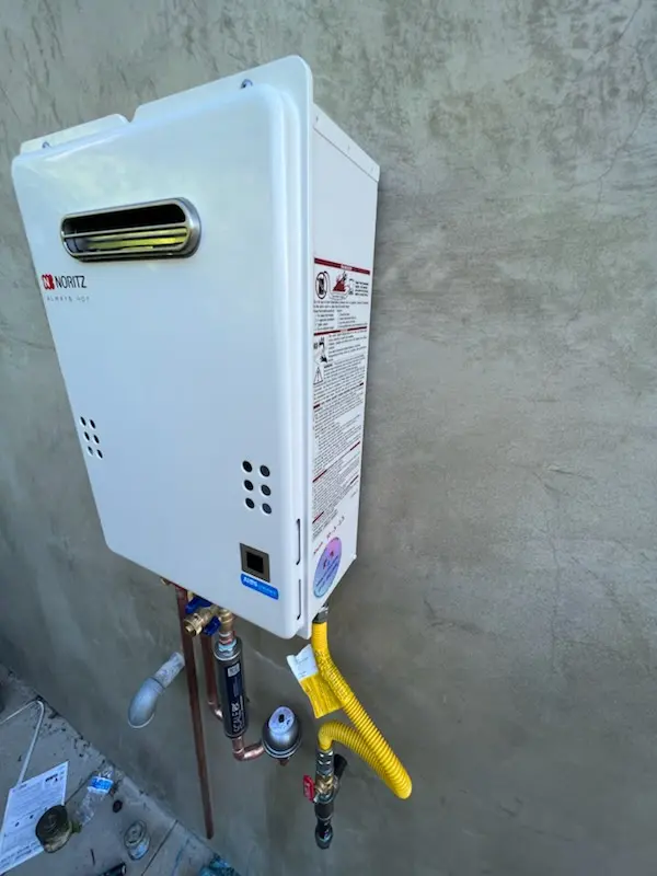 Tankless water heater installation for Willow Manor homes